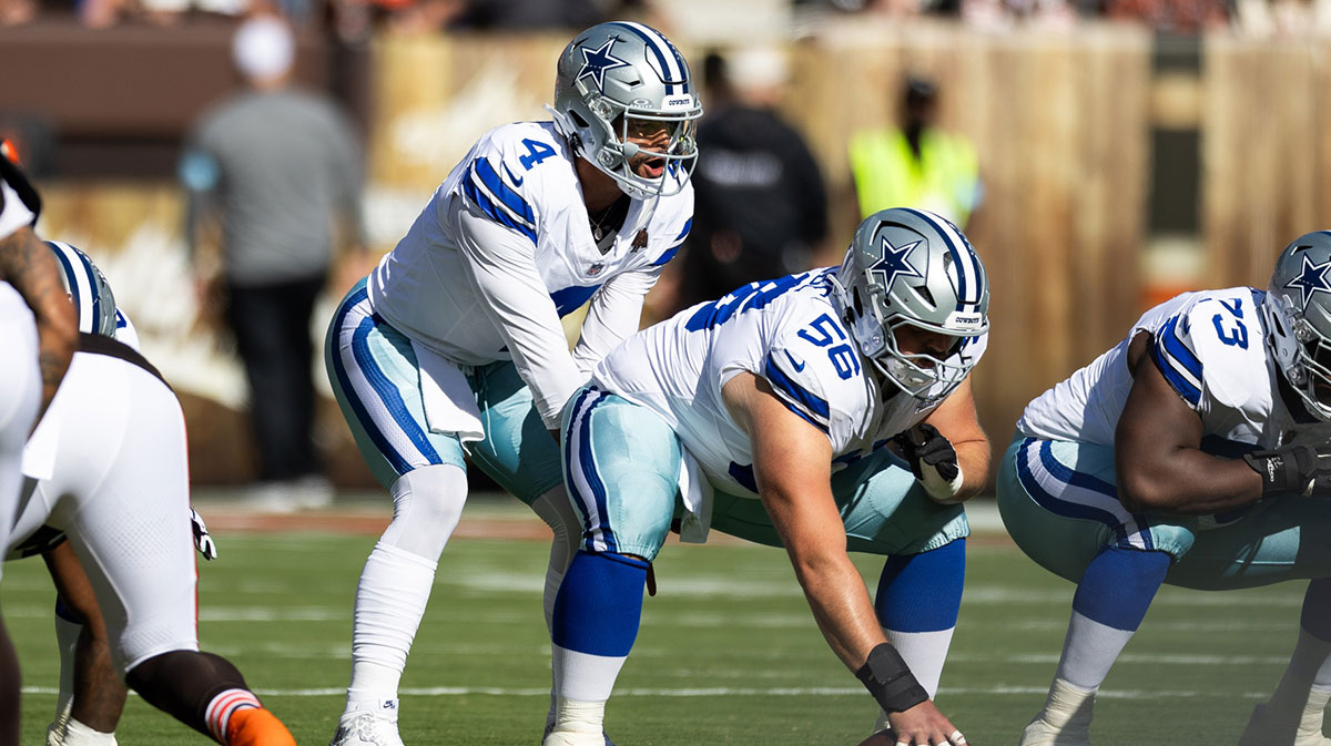 Dallas Cowboys quarterback Dak Prescott (4) lines up behind center Cooper Beebe (56) for the snap during the first quarter against the Cleveland Browns at Huntington Bank Field.