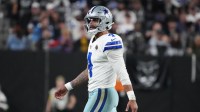 Dallas Cowboys quarterback Dak Prescott (4) walks onto the field against the Las Vegas Raiders during the second half at Allegiant Stadium.