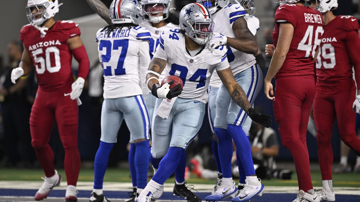 Dallas Cowboys defensive end Marshawn Kneeland (94) celebrates after recovering a blocked punt for a touchdown against the Arizona Cardinals in the first half at AT&T Stadium.