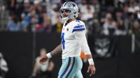 Dallas Cowboys quarterback Dak Prescott (4) walks onto the field against the Las Vegas Raiders during the second half at Allegiant Stadium.