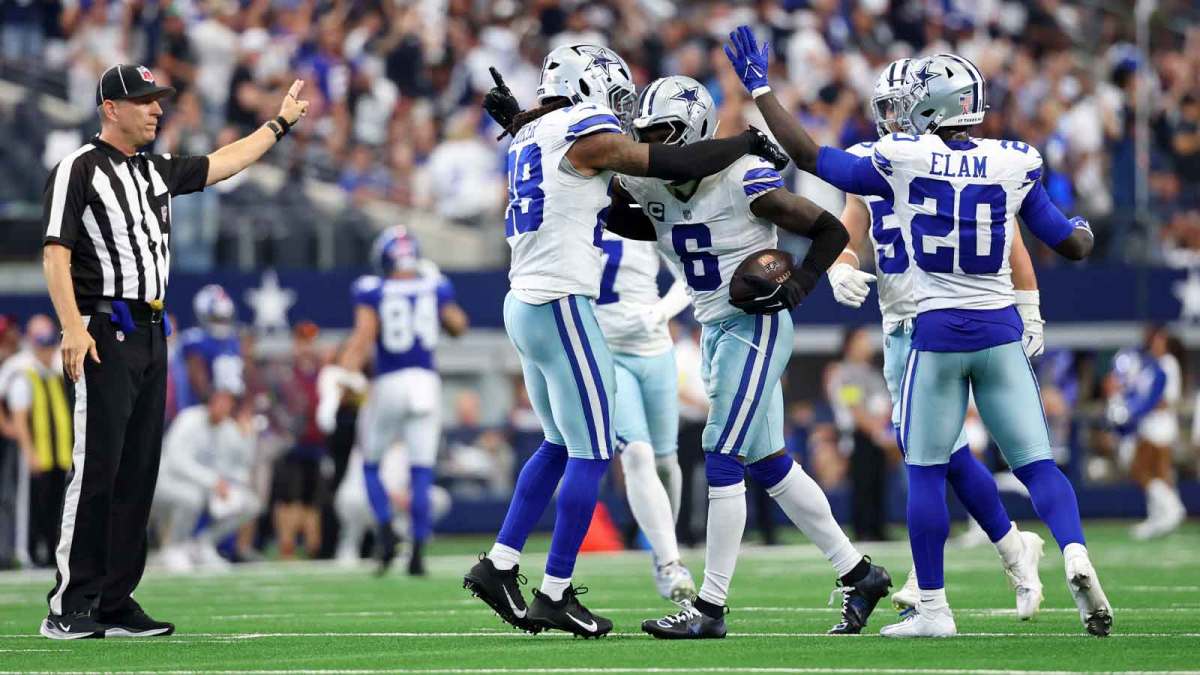 Dallas Cowboys safety Donovan Wilson (6) celebrates with safety Malik Hooker (28) after making an interception against the Dallas Cowboys during overtime at AT&T Stadium.