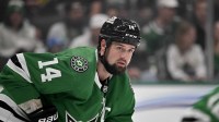 Dallas Stars left wing Jamie Benn (14) looks on during the face-off against the New York Islanders during the first period at the American Airlines Center.