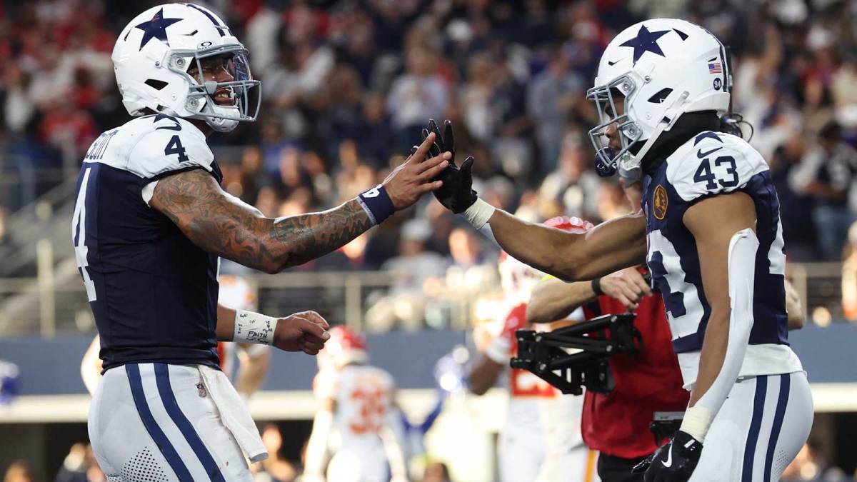 Dallas Cowboys quarterback Dak Prescott (4) and Dallas Cowboys running back Malik Davis (43) celebrate after a touchdown against the Kansas City Chiefs during the second quarter at AT&T Stadium.