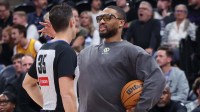Referee Jason Goldenberg (35) speaks with Portland Trail Blazers guard Damian Lillard (right) during the second half of a game against the Utah Jazz at Delta Center.