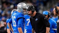 Detroit Lions quarterback Jared Goff (16) talks to head coach Dan Campbell before a play against Green Bay Packers during the first half at Ford Field in Detroit on Thursday, Nov. 27, 2025