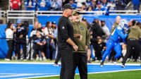 Detroit Lions head coach Dan Campbell talks to offensive coordinator John Morton at warmup ahead of the Minnesota Vikings game at Ford Field in Detroit on Sunday, November 2, 2025.