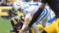 Pittsburgh Steelers linebacker T.J. Watt (90) and Indianapolis Colts quarterback Daniel Jones (17) go for a loose ball during the first half at Acrisure Stadium.