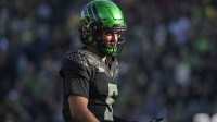 Oregon Ducks quarterback Dante Moore (5) looks on during the first half against the Southern California Trojans at Autzen Stadium.