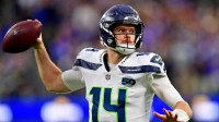 Seattle Seahawks quarterback Sam Darnold (14) throws a pass during the second half against the Los Angeles Rams at SoFi Stadium