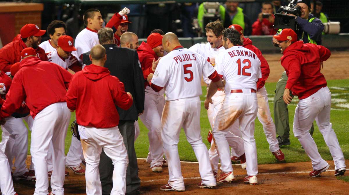 St. Louis Cardinals third baseman David Freese (23) celebrates with teammates after hitting a walk off home run in the 11th inning in game six of the 2011 World Series at Busch Stadium. The Cardinals won 10-9.