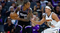 Sacramento Kings guard DeMar DeRozan (10) controls the ball against Denver Nuggets forward Aaron Gordon (32) during the first quarter at Golden 1 Center.