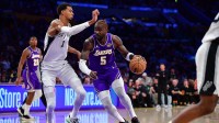 Los Angeles Lakers center Deandre Ayton (5) moves to the basket against San Antonio Spurs forward Victor Wembanyama (1) during the first half at Crypto.com Arena.