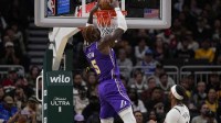 Los Angeles Lakers center Deandre Ayton (5) dunks during the first quarter against the Milwaukee Bucks at Fiserv Forum.