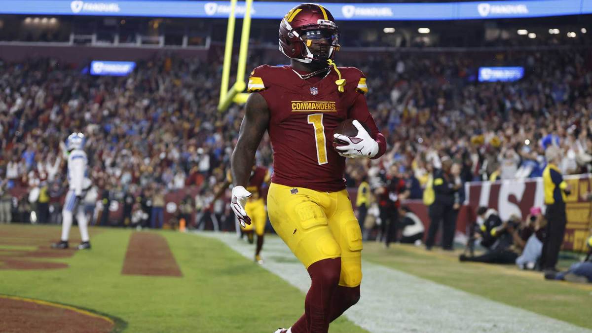 Washington Commanders wide receiver Deebo Samuel Sr. (1) reacts after scoring a touchdown during the third quarter against the Detroit Lions at Northwest Stadium.