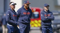 Chicago Bears defensive coordinator Dennis Allen (L), general manager Ryan Poles (C) and head coach Ben Johnson (R) observe during the Rookie Minicamp at Halas Hall.