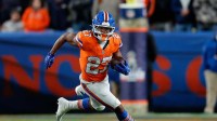 Denver Broncos running back J.K. Dobbins (27) runs the ball in the fourth quarter against the Las Vegas Raiders at Empower Field at Mile High.