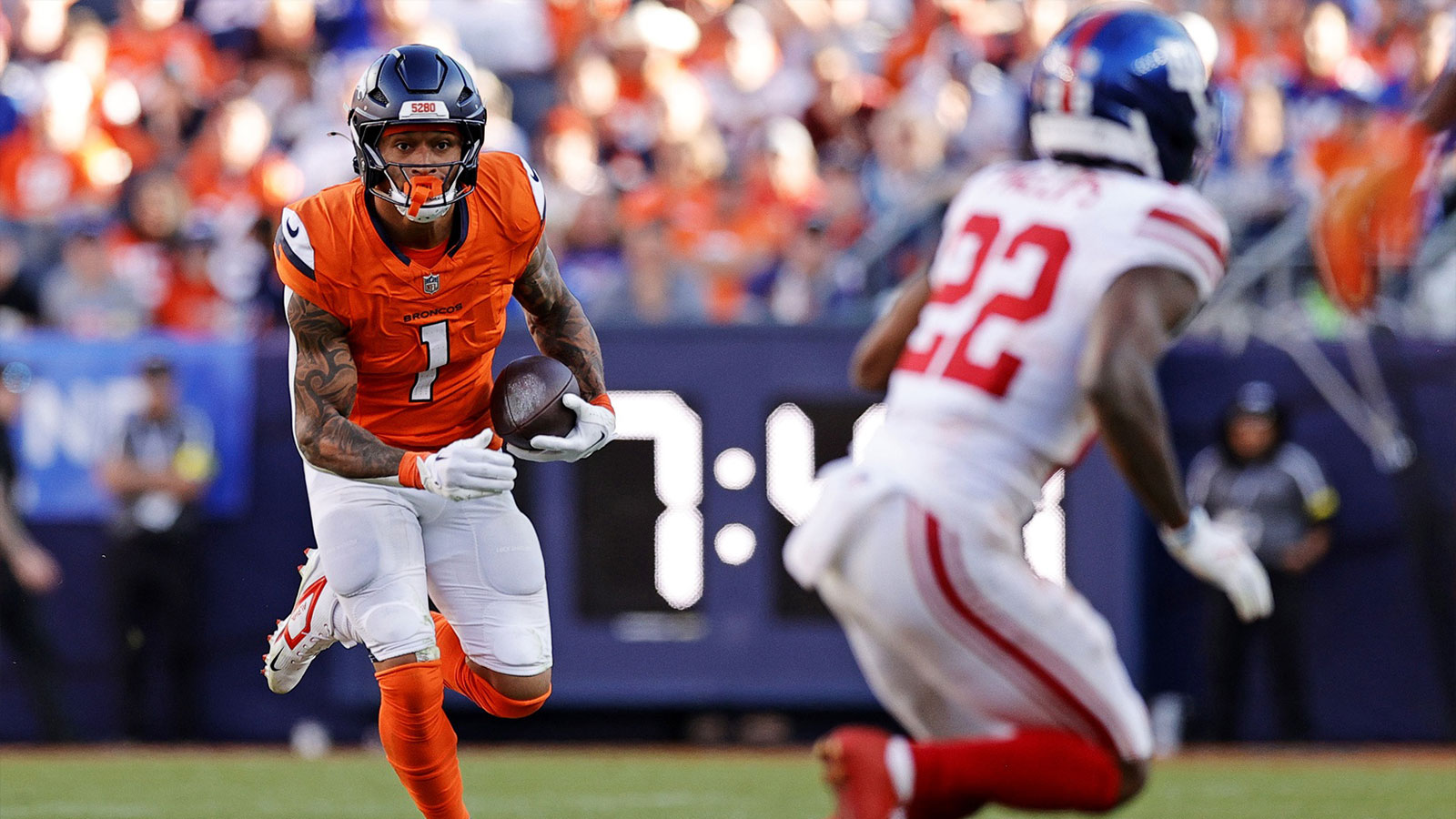 Denver Broncos tight end Evan Engram (1) runs the ball during the second half against the New York Giants