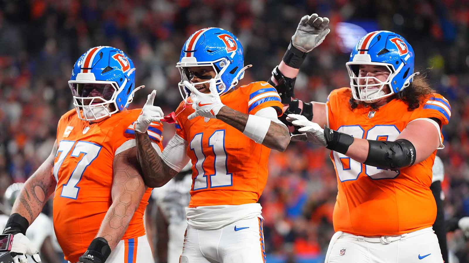 Denver Broncos wide receiver Troy Franklin (11) reacts after a touchdown during the first half at Empower Field at Mile High.