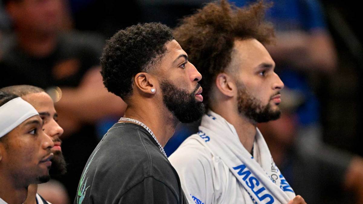 Dallas Mavericks forward Anthony Davis (left) and center Dereck Lively II (right) look on during an NBA Cup game between the Mavericks and the Clippers at the American Airlines Center.
