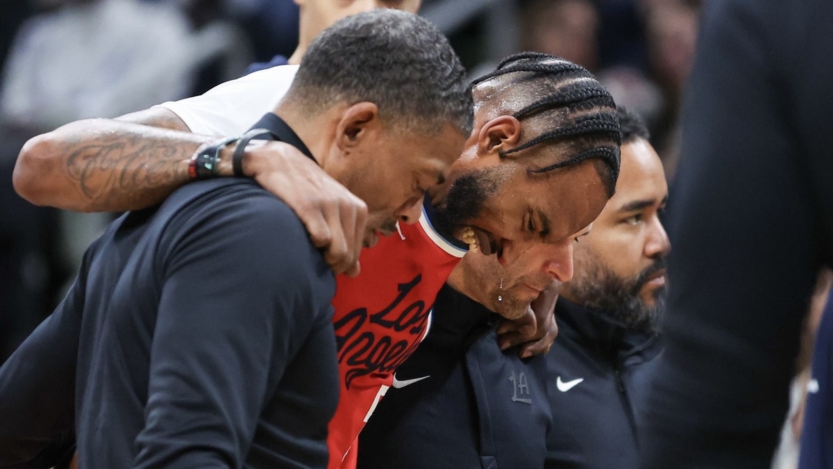 Los Angeles Clippers forward Derrick Jones Jr (5) is helped off the court during the first half against the Los Angeles Clippers at TD Garden.