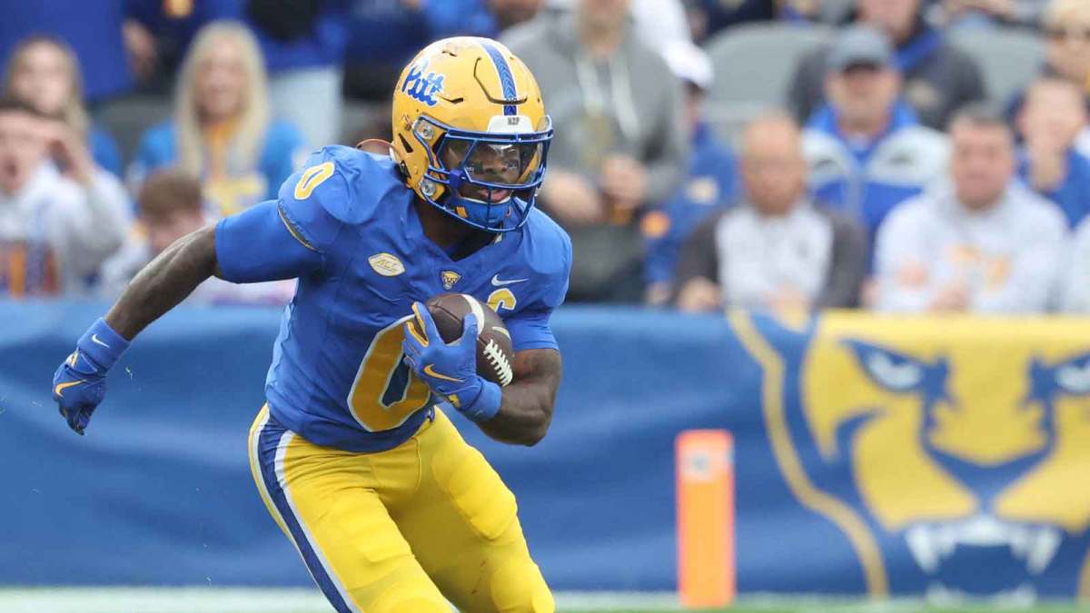 Pittsburgh Panthers running back Desmond Reid (0) runs after catch against the Notre Dame Fighting Irish during the first quarter at Acrisure Stadium.