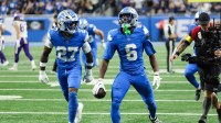 Detroit Lions cornerback Terrion Arnold (6) celebrates an interception in the second quarter against the Minnesota Vikings at Ford Field.