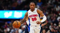 Detroit Pistons forward Ronald Holland II (00) dribbles up court in the second half against the Denver Nuggets at Ball Arena.