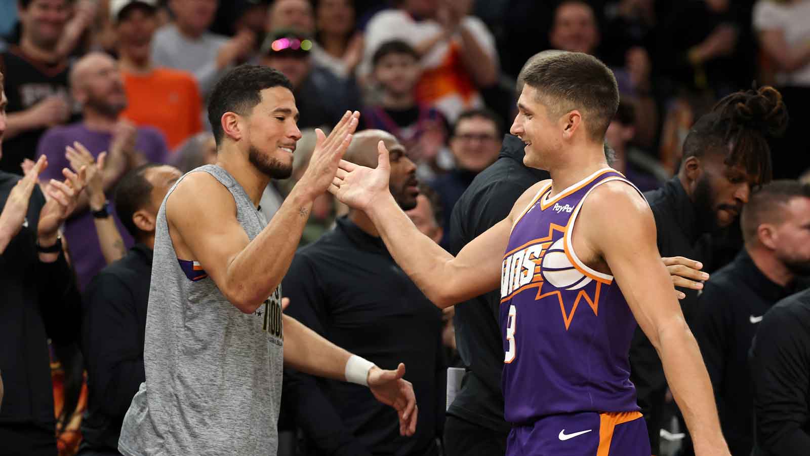 Phoenix Suns guard Grayson Allen (8) celebrates with Devin Booker after being pulled from the game after setting the franchise record for three pointers in a game against the New Orleans Pelicans in the second half at the Mortgage Matchup Center.