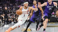 Phoenix Suns guard Devin Booker (1) drives to the basket against the Sacramento Kings during the second quarter at Golden 1 Center.