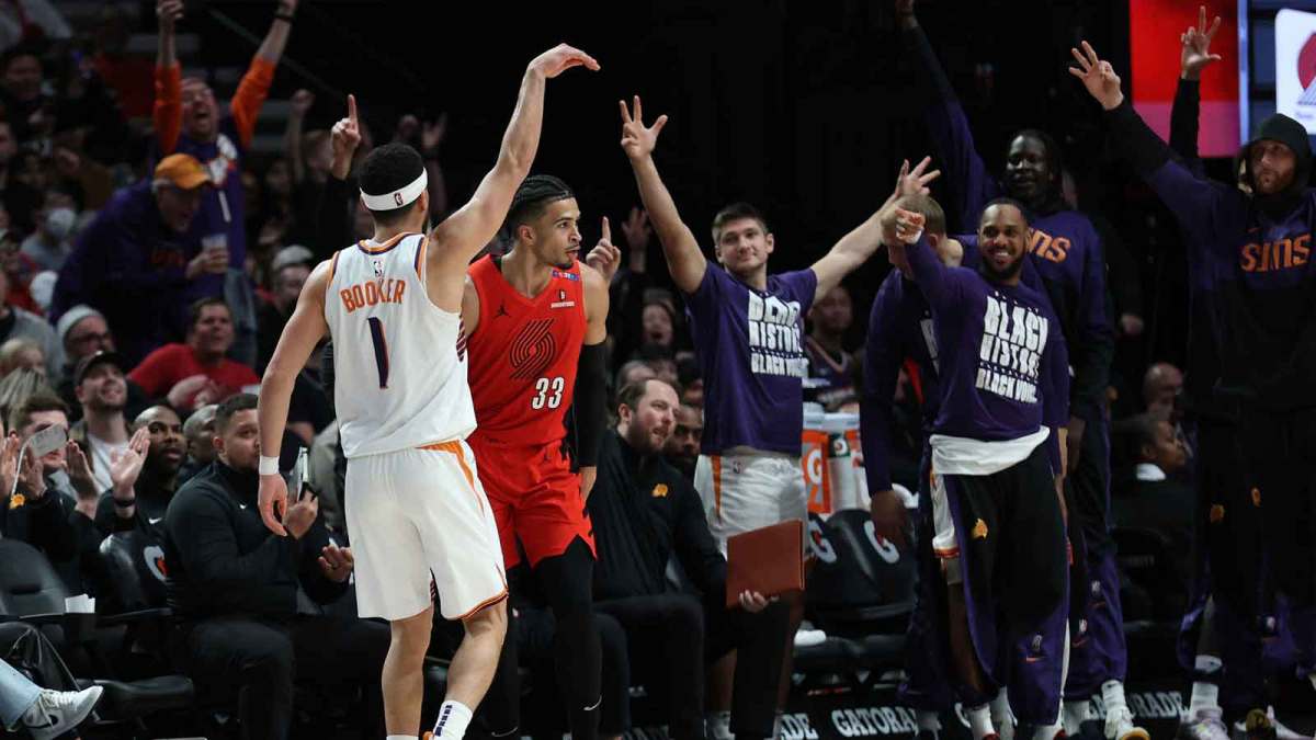 Phoenix Suns guard Devin Booker (1) reacts after scoring against the Portland Trail Blazers to make Booker the Suns’ all-time leading scorer in the second half at Moda Center.