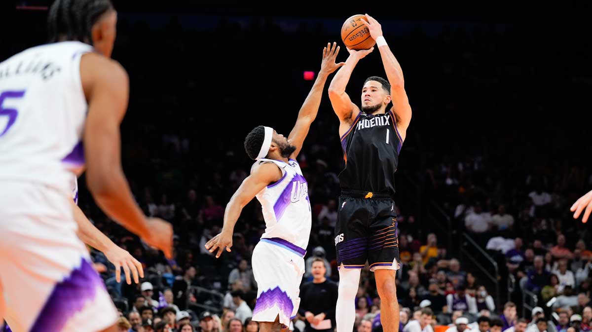 Phoenix Suns guard Devin Booker (1) takes a shot in the second half between the Phoenix Suns and the Utah Jazz at Mortgage Matchup Center.