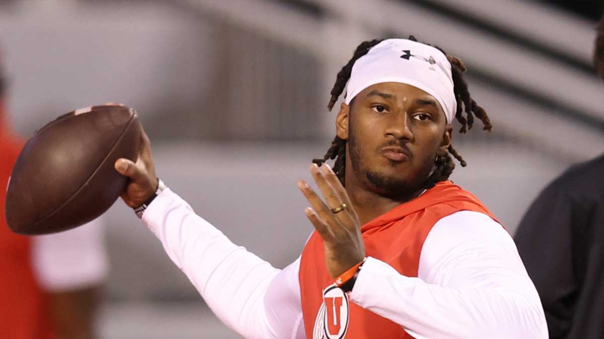 Utah Utes quarterback Devon Dampier (4) warms up berfore the game against the Colorado Buffaloes at Rice-Eccles Stadium.