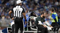 Green Bay Packers defensive tackle Devonte Wyatt (95) is carted off the field after an injury against the Detroit Lions during the third quarter at Ford Field.