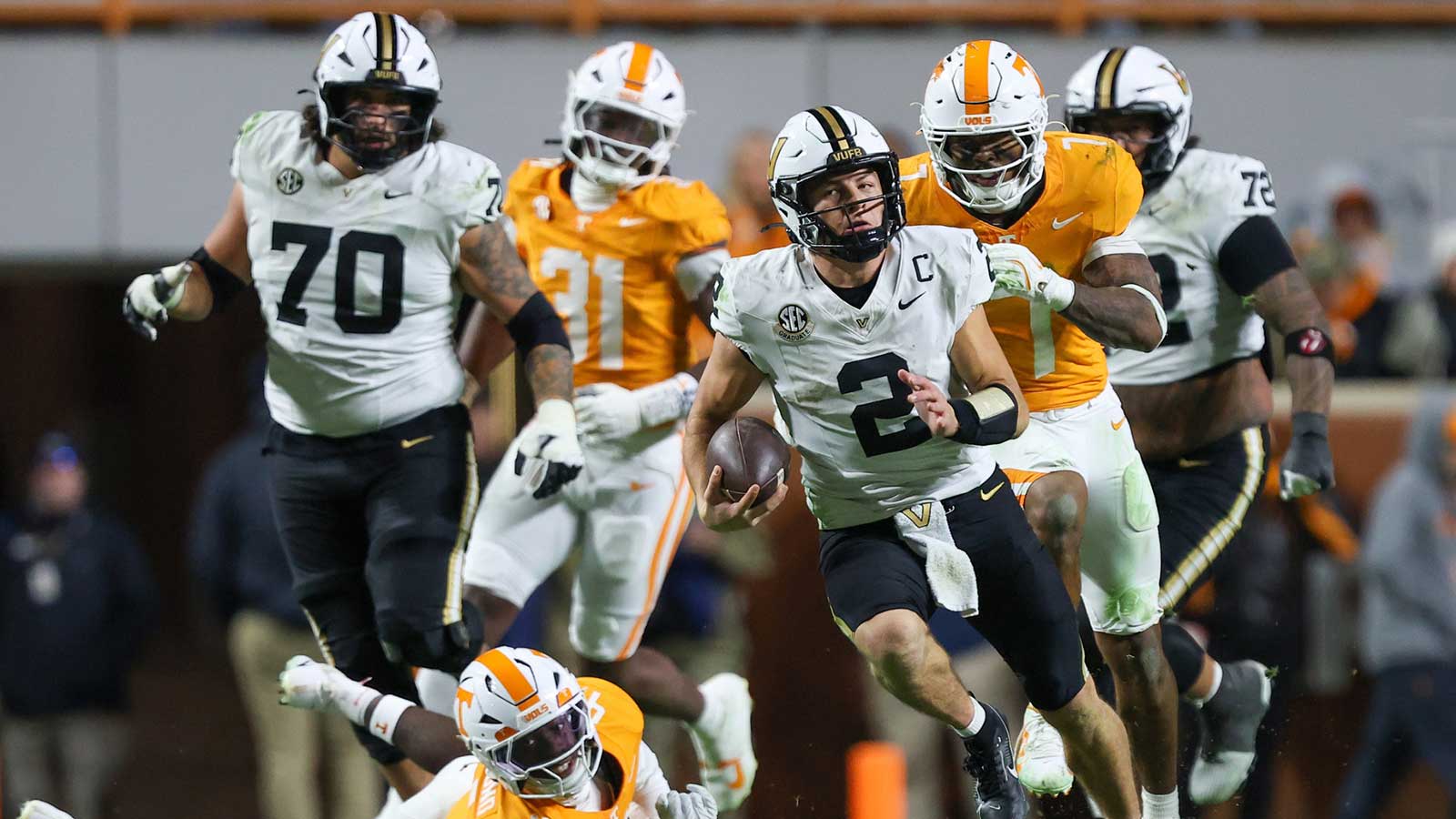 Vanderbilt Commodores quarterback Diego Pavia (2) runs against the Tennessee Volunteers during the second half at Neyland Stadium.