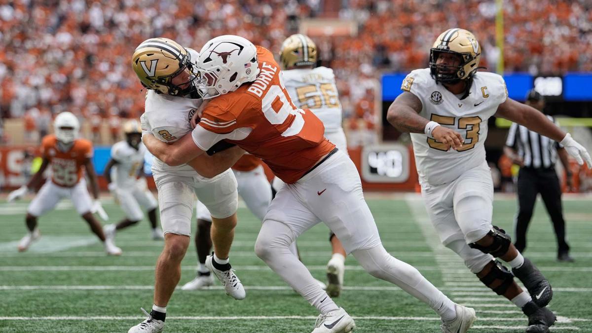Texas Longhorns defensive lineman Ethan Burke (91) sacks Vanderbilt Commodores quarterback Diego Pavia (2) on the one yard line during the second half at Darrell K Royal-Texas Memorial Stadium. Mandatory Credit: Scott Wachter-Imagn Images