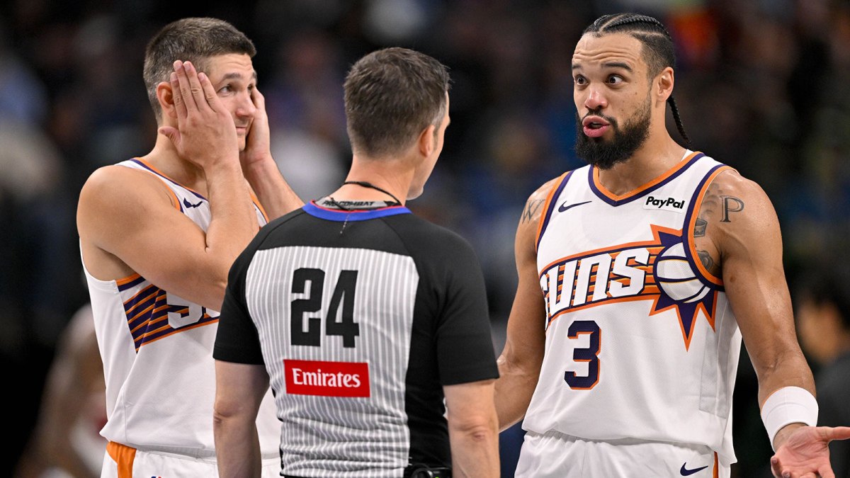 Phoenix Suns forward Dillon Brooks (3) argues a call with referee Kevin Scott (24) as guard Grayson Allen (8) looks on during the second half against the Dallas Mavericks at the American Airlines Center.