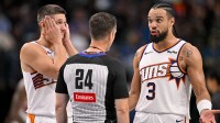 Phoenix Suns forward Dillon Brooks (3) argues a call with referee Kevin Scott (24) as guard Grayson Allen (8) looks on during the second half against the Dallas Mavericks at the American Airlines Center.