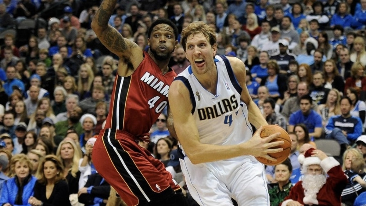 Dallas Mavericks power forward Dirk Nowitzki (41) drives past Miami Heat power forward Udonis Haslem (40) during the second quarter at the American Airlines Center.