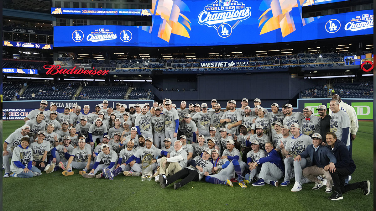 The Los Angeles Dodgers pose for a group photo on the field after defeating the Toronto Blue Jays in game seven of the 2025 MLB World Series at Rogers Centre. Mandatory Credit: John E. Sokolowski-Imagn Images