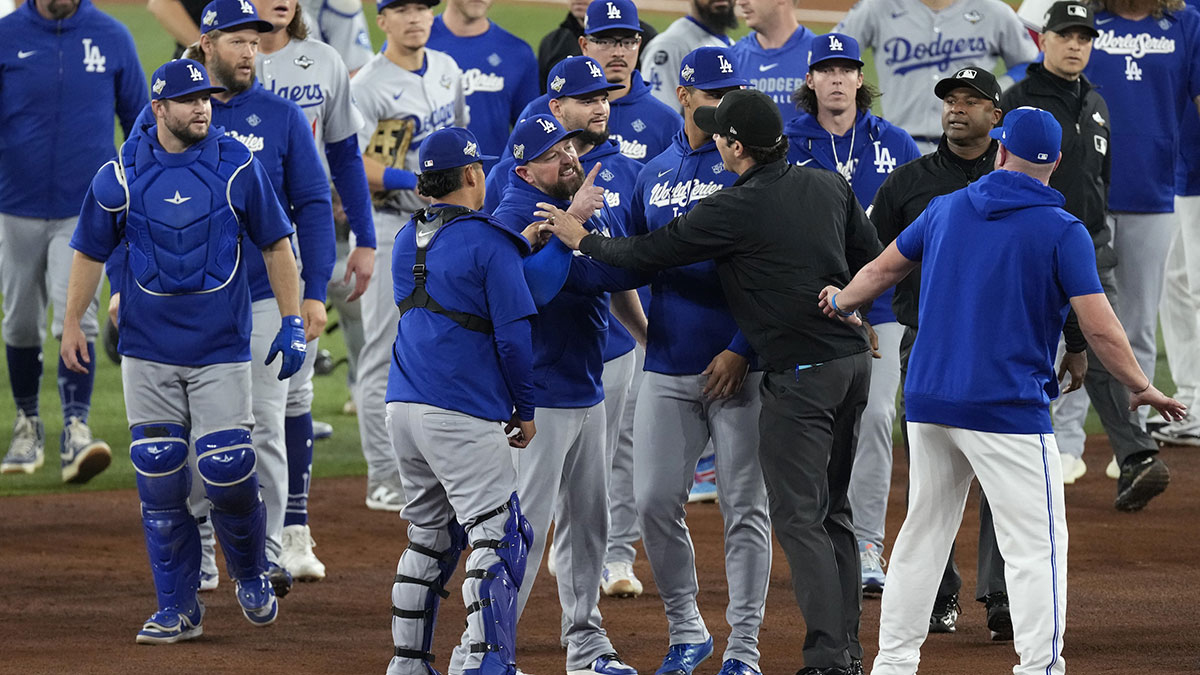 Toronto Blue Jays manager John Schneider (14) argues after the benches clear in the fourth inning against the Los Angeles Dodgers during game seven of the 2025 MLB World Series at Rogers Centre. Mandatory Credit: Kevin Sousa-Imagn Images