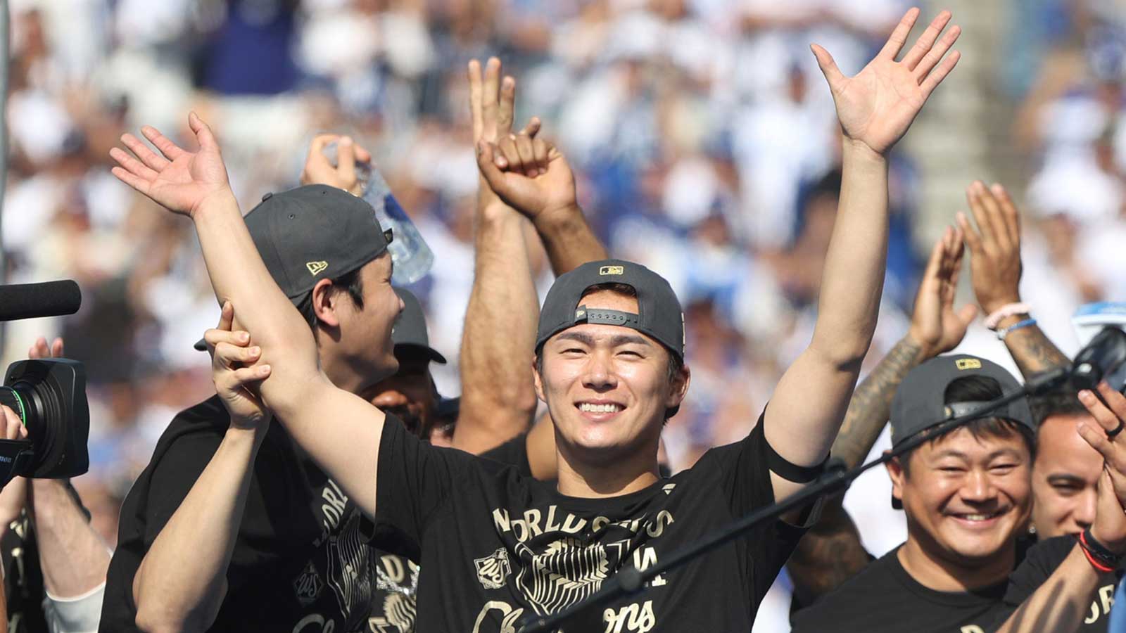 World Series MVP Yoshinobu Yamamoto has his arms raised by Shohei Ohtani during the 2025 World Series championship celebration at Dodger Stadium in Los Angeles on Monday, Nov. 3, 2025.