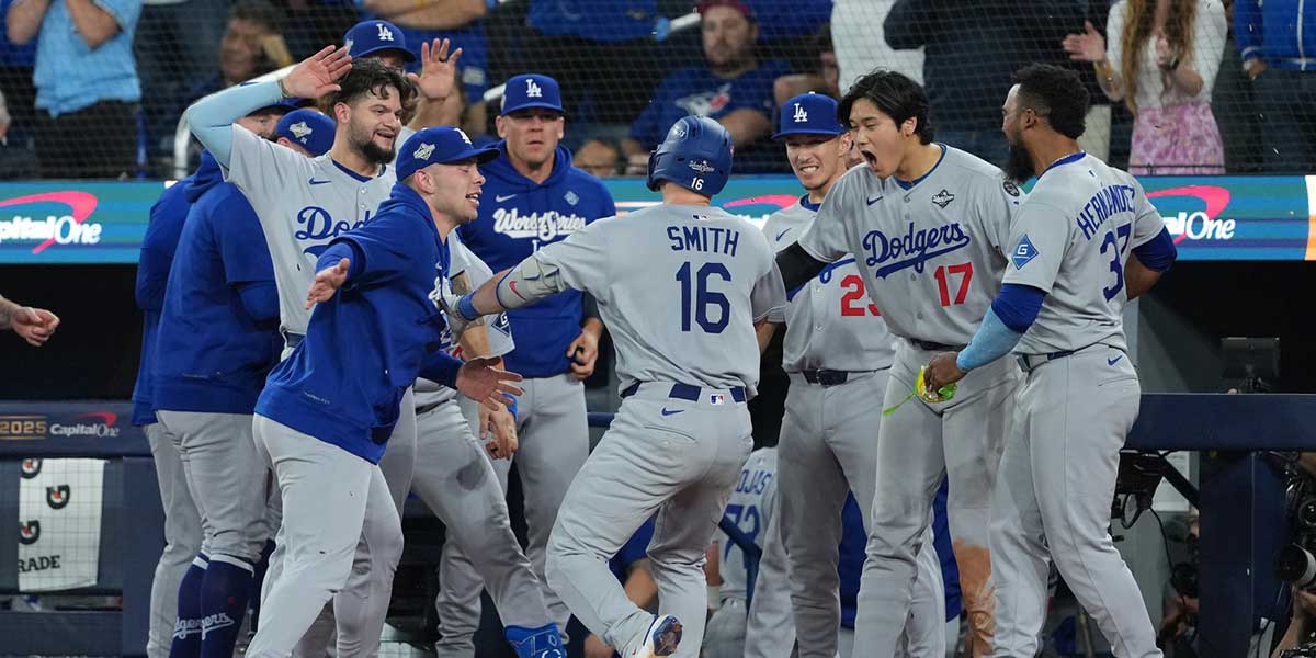 Los Angeles Dodgers catcher Will Smith (16) reacts after hitting a home run against the Toronto Blue Jays in the eleventh inning for game seven of the 2025 MLB World Series at Rogers Centre.