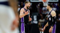 Sacramento Kings forward Domantas Sabonis (11) talks with guard Zach LaVine (8) during the second quarter against the Dallas Mavericks at Golden 1 Center.