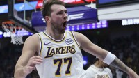 Los Angeles Lakers guard Luka Doncic (77) reacts to a play against the Utah Jazz during the second quarter at Delta Center.