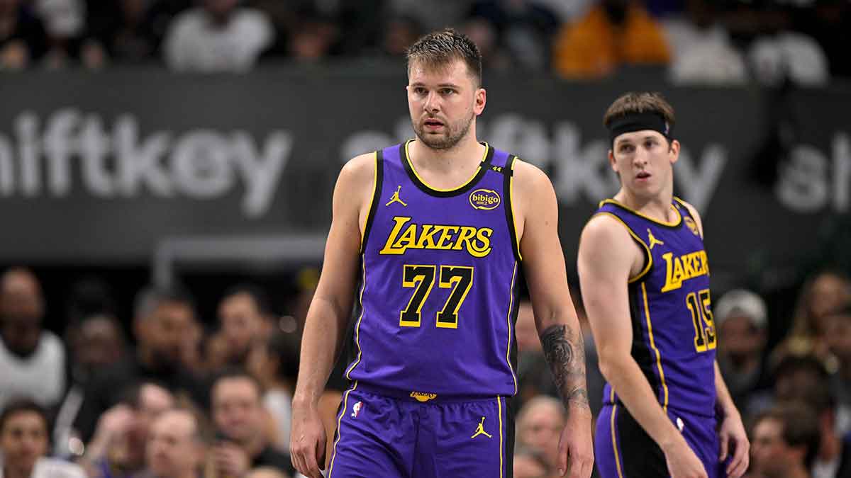 Los Angeles Lakers guard Luka Doncic (77) and guard Austin Reaves (15) during the game between the Dallas Mavericks and the Los Angeles Lakers at American Airlines Center.