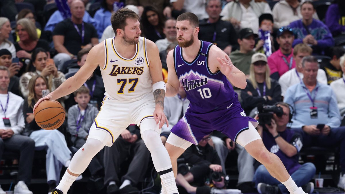 Los Angeles Lakers guard Luka Doncic (77) posts up against Utah Jazz guard Svi Mykhailiuk (10) during the second half at Delta Center.