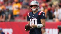 New England Patriots quarterback Drake Maye (10) warms up before a game against the Tampa Bay Buccaneers at Raymond James Stadium.