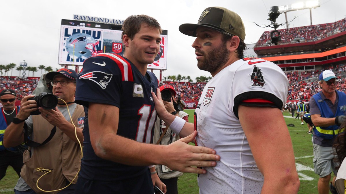 New England Patriots quarterback Drake Maye (10) and Tampa Bay Buccaneers quarterback Baker Mayfield (6) shake hands following a game at Raymond James Stadium.