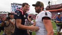 New England Patriots quarterback Drake Maye (10) and Tampa Bay Buccaneers quarterback Baker Mayfield (6) shake hands following a game at Raymond James Stadium.