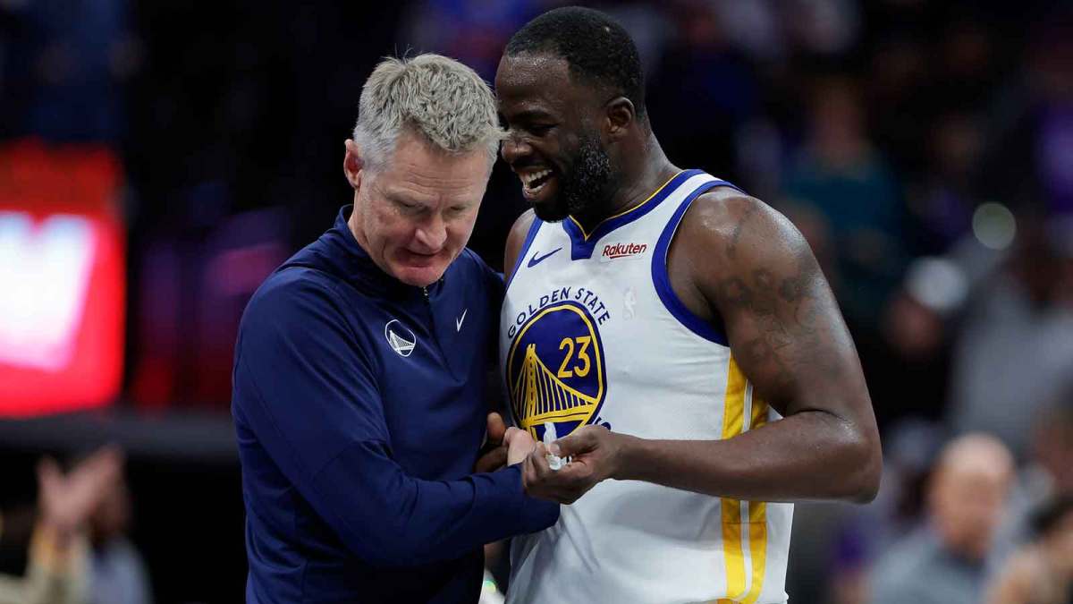 Golden State Warriors forward Draymond Green (23) talks with head coach Steve Kerr during the fourth quarter against the Sacramento Kings at Golden 1 Center.